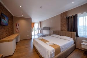 Postel nebo postele na pokoji v ubytování Lider Hotel