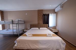 Postel nebo postele na pokoji v ubytování Lider Hotel