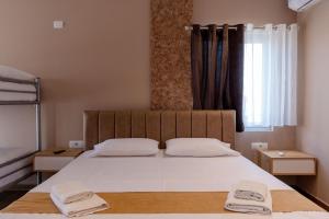Postel nebo postele na pokoji v ubytování Lider Hotel