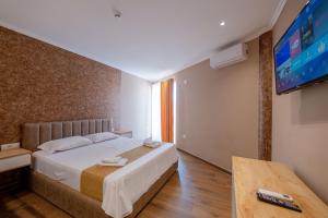 Postel nebo postele na pokoji v ubytování Lider Hotel