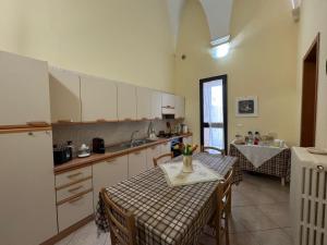 Kuchyň nebo kuchyňský kout v ubytování B&B La Corte