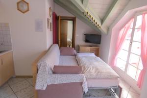 TV a/nebo společenská místnost v ubytování Casa Azzurra