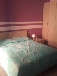 Ένα ή περισσότερα κρεβάτια σε δωμάτιο στο Villa Antonietta