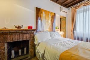 Postel nebo postele na pokoji v ubytování Luxury Trastevere