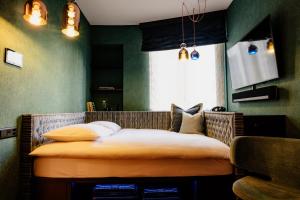Televiisor ja/või meelelahutuskeskus majutusasutuses Opera Hotel Zürich