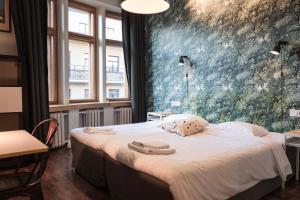 Postel nebo postele na pokoji v ubytování Hotel Finn