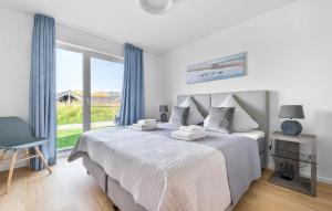 En eller flere senge i et værelse på Wellenspiel + 14 billeder