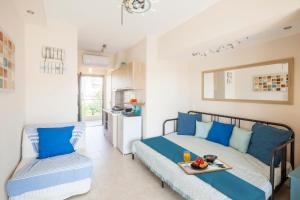 a bedroom with a bed with a tray of food on it at Coco cozy home in Pefkochori