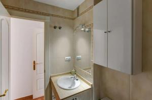 a bathroom with a sink and a mirror at Cabo de Gata - Apartamento al lado de la playa in La Isleta del Moro +17 photos