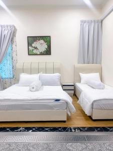 Ένα ή περισσότερα κρεβάτια σε δωμάτιο στο D Corner Homestay