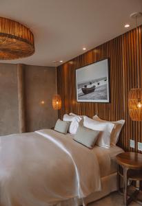Ein Bett oder Betten in einem Zimmer der Unterkunft Yemanjá Hotel by Preabeach Experience