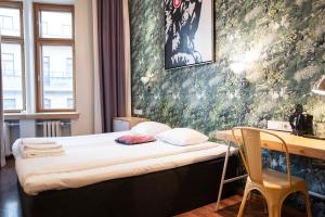 Postel nebo postele na pokoji v ubytování Hotel Finn