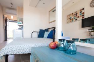 a room with a bed and a table with fruit on it at Coco cozy home in Pefkochori