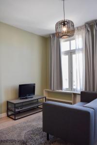 a living room with a couch and a tv at NEW Roof terrace apartment in Jordaan Area in Amsterdam