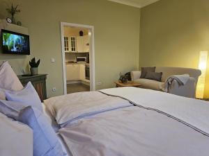 Giường trong phòng chung tại Ferienhof SchilfMeer - Fewo "Seepferdchen" +17 ảnh