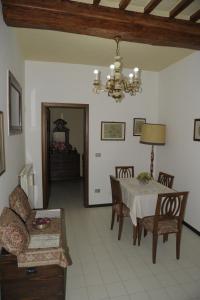 a living room with a table and a couch at La Casetta sul Corso in Gubbio