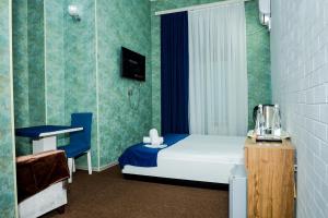Ένα ή περισσότερα κρεβάτια σε δωμάτιο στο Best Center Inn Hotel