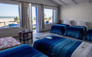 Una cama o camas en una habitación de Dakhla Attitude