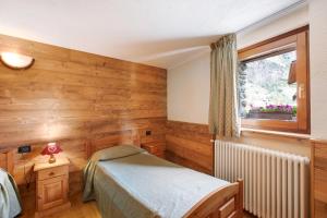 Giường trong phòng chung tại Maison Godioz - Appartamento 1