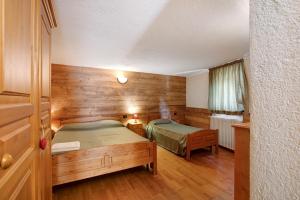 Giường trong phòng chung tại Maison Godioz - Appartamento 1