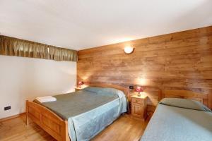 Giường trong phòng chung tại Maison Godioz - Appartamento 1