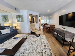 a living room with a couch and a table at North Shore Inn TC 203 in Traverse City