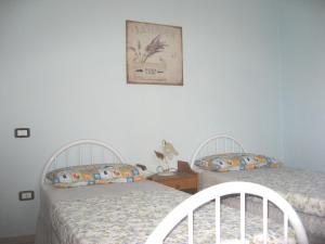 Posteľ alebo postele v izbe v ubytovaní Casa Bruno B&B