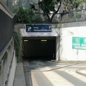 a tunnel with a parking sign in a building at L'Escale in Dijon