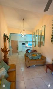 a living room with a couch and a table at Bar street apartment in Ayia Napa