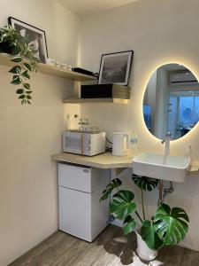 Kuchyň nebo kuchyňský kout v ubytování 所在行旅2館-渡咕所在 UrbanAbode2-DUGU