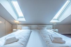 Postel nebo postele na pokoji v ubytování fewo1846 Strandresidenz Wassersleben - Strandkoje - komfortables Studioapartment mit Meerblick am Strand