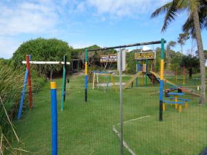 a park with a playground with a play equipment at Vila Axé Flat Lua in Prado