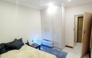 Ένα ή περισσότερα κρεβάτια σε δωμάτιο στο GUEST HOUSE In MIDRAND