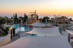 a water park with a water slide and a water slide at Adjacent to Aphrodite Premium Apartments I in Kouklia