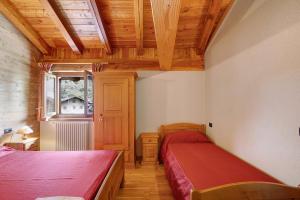 Giường trong phòng chung tại Maison Godioz - Appartamento 6 +8 ảnh