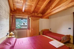 Giường trong phòng chung tại Maison Godioz - Appartamento 6