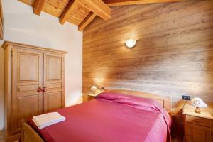 Giường trong phòng chung tại Maison Godioz - Appartamento 6