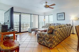 a living room with a couch and a table at Ocean Vista #1101 in South Padre Island