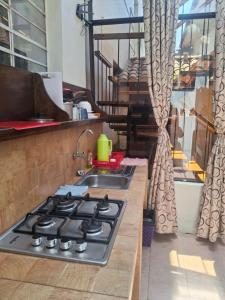 Una cocina o zona de cocina en Departamentos Cusco