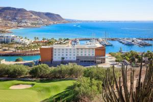 a view of a hotel and the ocean at Courtyard by Marriott La Paz Baja California Sur in La Paz