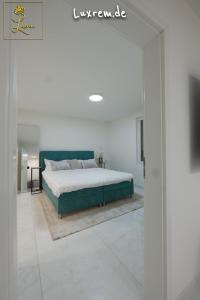 Postel nebo postele na pokoji v ubytování Luxrem Apartments 4