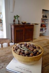 a bowl of nuts sitting on top of a table at La Grande Maison de Migou in Larrazet
