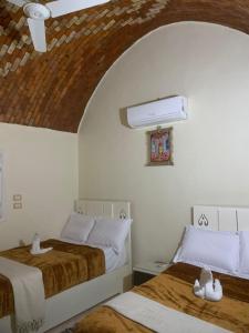 Postel nebo postele na pokoji v ubytování Tawy Guest House