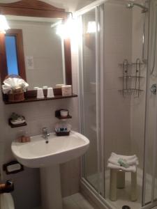 a bathroom with a sink and a shower at Hotel San Giorgio in Sauze dʼOulx