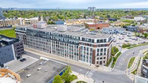 an aerial view of a large building in a city at Entire 1 bedroom in the heart of KW downtown across Google in Kitchener