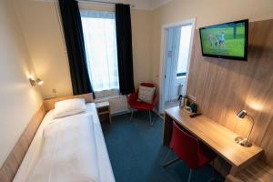 Sjónvarps- og/eða afþreyingartæki á Prinsen Hotel