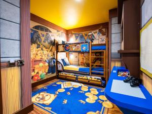 a childrens bedroom with a bunk bed with a blue carpet at LEGOLAND(R) Windsor Resort in Windsor