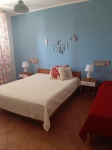 Postel nebo postele na pokoji v ubytování Residence Le Perle Beach + 23 fotografií