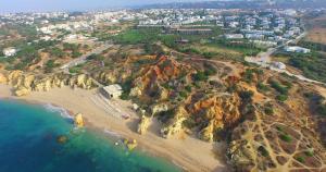 an aerial view of a beach with rocks at Kimpton Atlantico Algarve by IHG in Albufeira