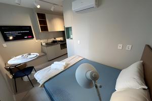 a hospital room with a bed and a sink at Ap Luxury Pamplona MASP Cd 206 in Sao Paulo
